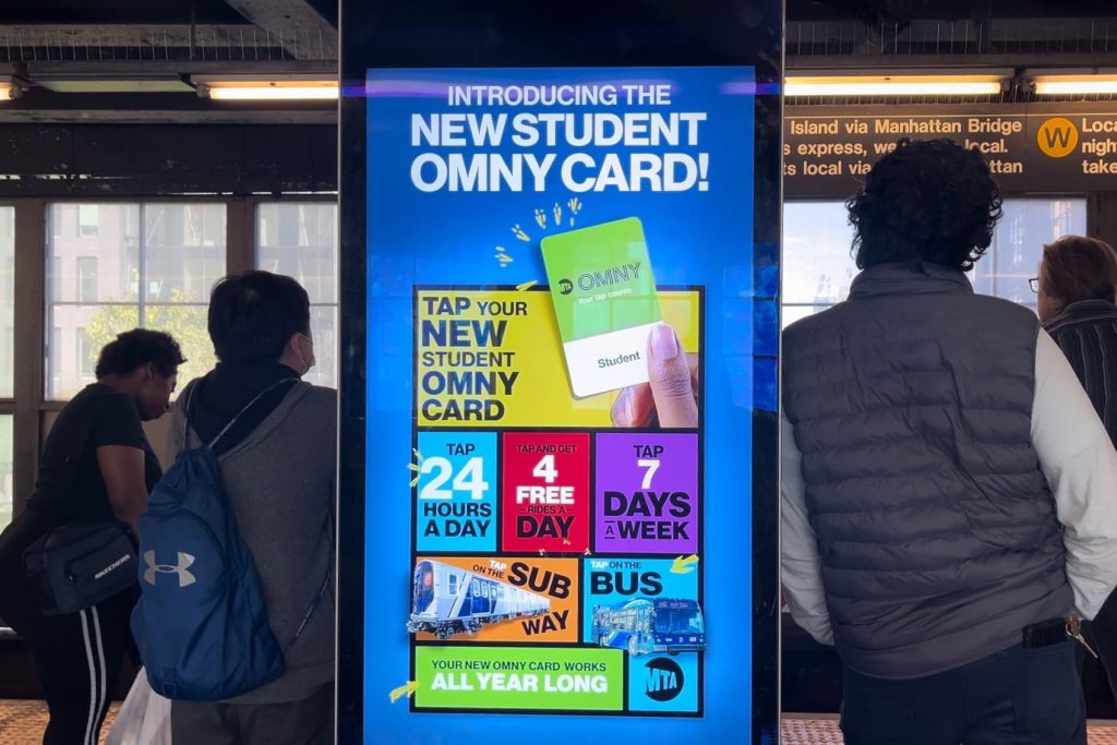 A digital screen at Queensboro Plaza station introducing the new OMNY cards.