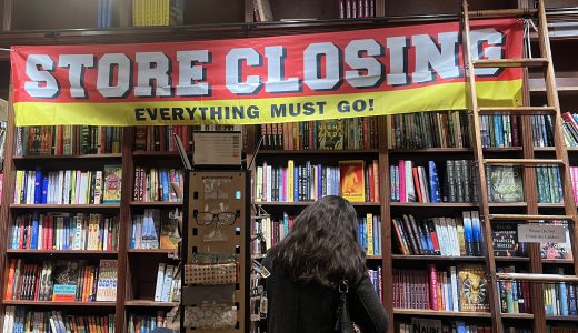 Store closing sign inside of Shakespeare &Co