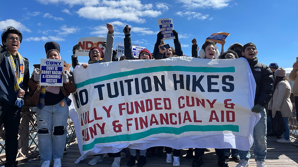 Students and faculty members displayed a show of unity while marching across Brooklyn Bridge on March 19th to speak against tuition hikes and lack of funding to CUNY institutions.