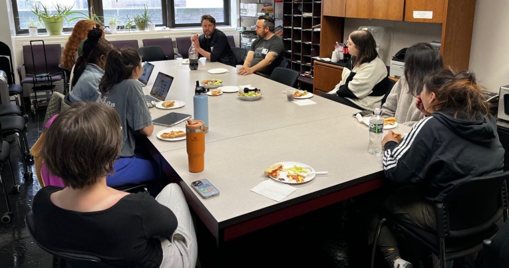 Hunter Journalism students enjoyed pizza as they listened to documentary filmmakers Dominic Smith and Andrew Robinson discuss their work Tuesday afternoon