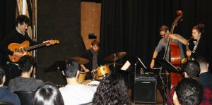 Band playing in black box theater