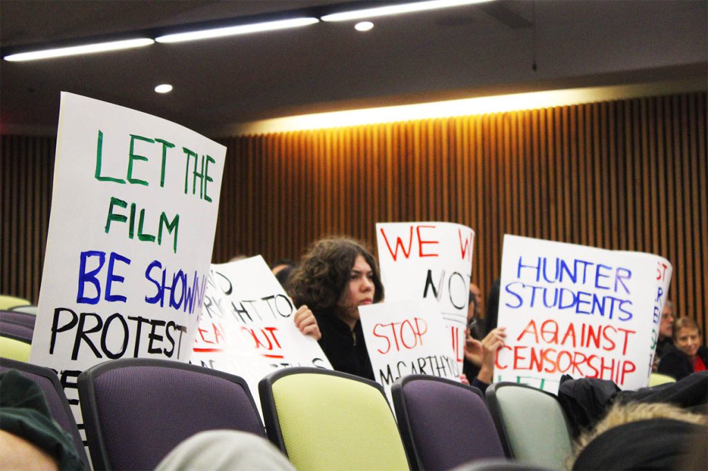 Students at the November 16 Hunter Senate meeting display signs condemning the Hunter Administration's censorship