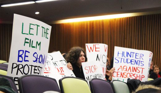 Students at the November 16 Hunter Senate meeting display signs condemning the Hunter Administration's censorship
