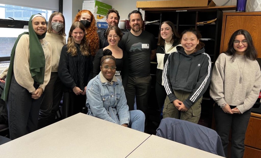 11 people gather for a photo