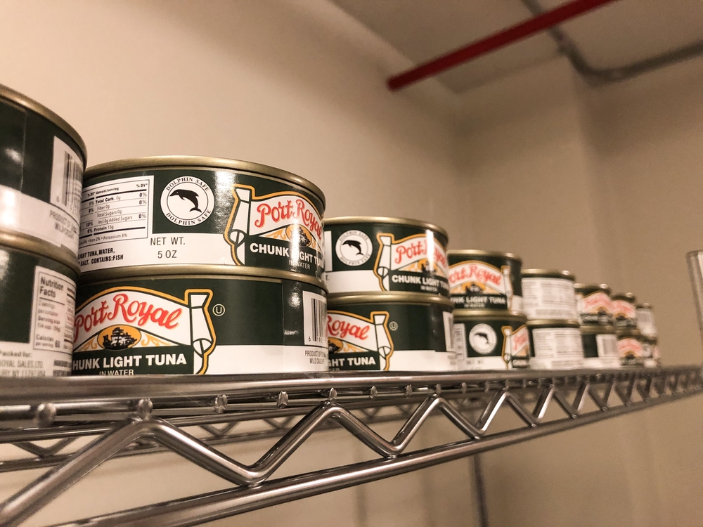 A shelf full of canned tuna at The Purple Apron