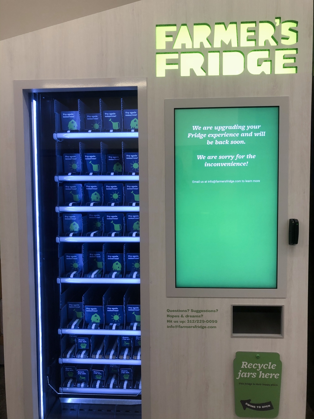 An empty Farmer's Fridge in the Brookdale dorm with a sign that says the company is upgrading the fridge.