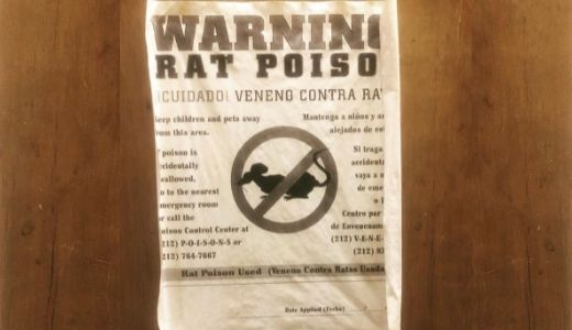 A sign posted in the basement of Brookdale warning of rat poison.