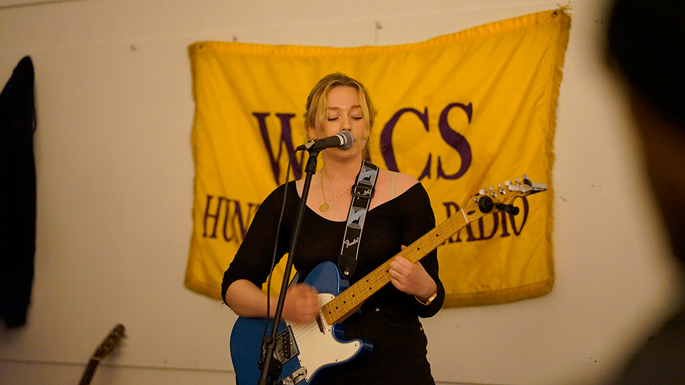 Kate Bird performing her original song “Man, Go” at WHCS’s open mic night.
